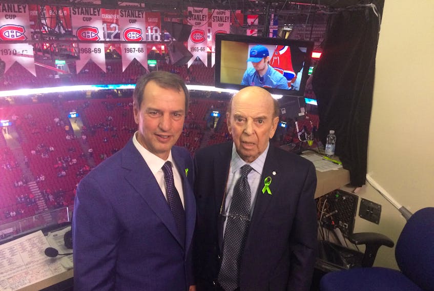 Bob Cole and broadcast partner Greg Millen posed for a photo together in the CBC booth over centre ice at the Bell Centre Saturday night prior to the start of Cole’s final game as a Hockey Night in Canada broadcaster.