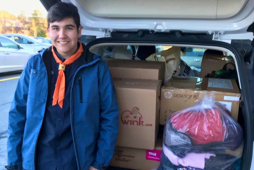 Morgan is an employee at Giant Tiger in Sackville NS and a member of the 7th Sackville Venturer troop.  At his urging, his Scout group collected 11 boxes of coats this year.