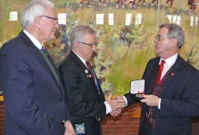 Ray Coulson of Amherst (centre) receives the Senate of Canada 150 Medal from Senator Michael MacDonald (right) while Cumberland-Colchester MP Bill Casey looks on. Coulson is the curator of the North Nova Scotia Highlanders Regimental Museum that’s located in the Col. James Layton Ralston Armoury in Amherst.