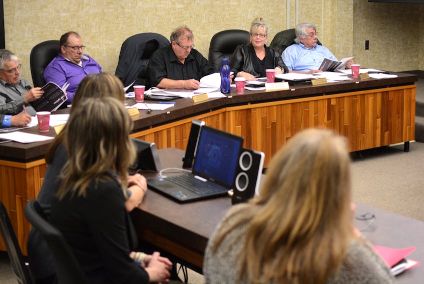Councillor Maryanne Jackson talks to a group giving a presentation to county council on May 15, while the other councillors read documents handed out by the group. Following the presentation, Jackson and councillor Ernie Gilbert, left, debated the need for an 2 cent tax increase in the 2019-2020 budget.