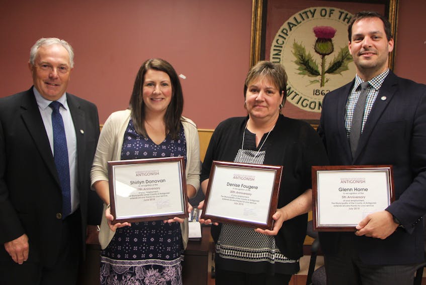 As part of their June 19 meeting, Municipality of the County of Antigonish council presented staff service awards to three individuals for reaching milestone years with the municipality. Warden Own McCarron made presentations to strategic initiative co-ordinator Shirlyn Donovan for 10 years, recreation administrative assistant Denise Fougere for 30 years and municipal clerk/treasurer Glenn Horne for five years.