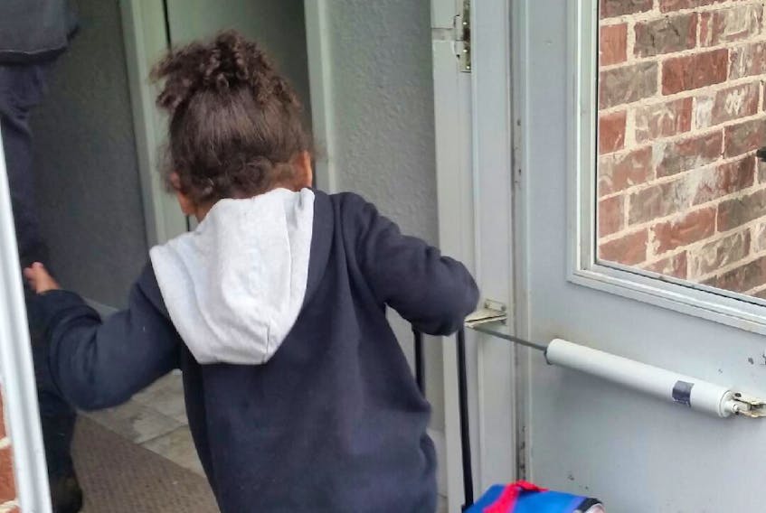 A child walking into a new home in Halifax. Adsum Women & Children is launching a new project called Unlocking Hope, to help women and families find housing and move away from domestic violence and toward stability and self-determination.