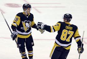 Pittsburgh Penguins winger Jake Guentzel (59) celebrates his goal with Sidney Crosby (87) against the New York Rangers during the third period at the PPG Paints Arena in Pittsburgh. The goal was the the 100th career NHL goal for Guentzel. The Penguins won 3-2. - Charles LeClaire / USA Today Sports