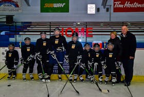 Trina and Troy Crosby, far right, pose with eight Nova Scotia hockey players who received full sets of donated CCM equipment from their son Sidney. (CONTRIBUTED)