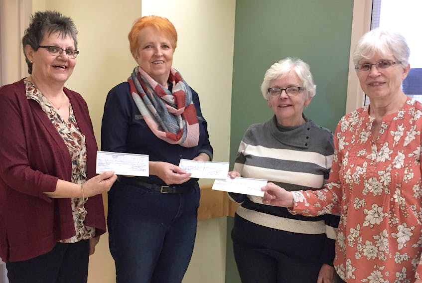 Presenting cheques to the Alda Fromm (right), Cumberland Health Care Auxiliary treasurer, is (from left) Linda Long, gift shop treasurer; Ida Roode, co-chair of the Highland Fling committee; and Heather LeMoine, coffee shop committee member.