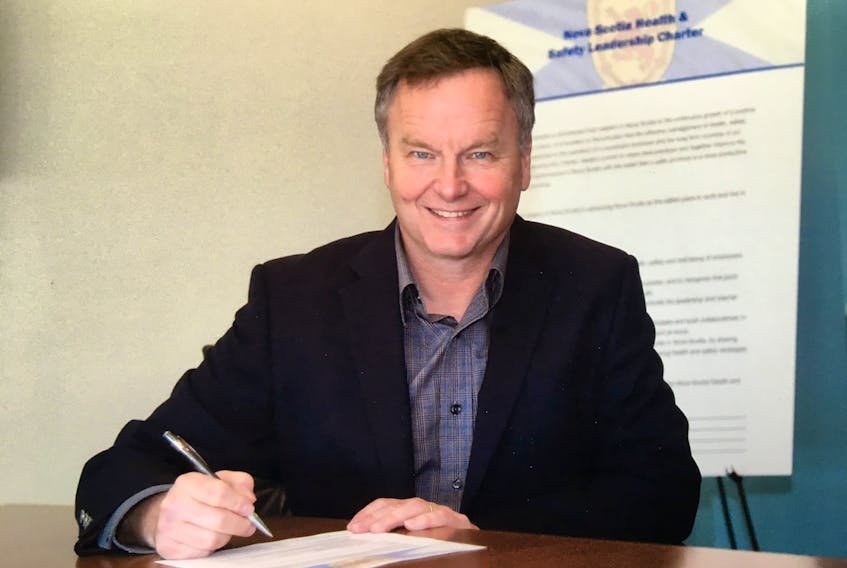 Bruce Chapman, general manager, Northern Pulp, signs the Nova Scotia Health & Safety Charter. (Contributed)