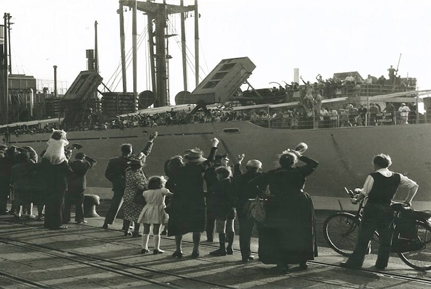 Photograph of people waving farewell to a departing ship in Rotterdam in the late 1940s. 
Contributed: Canadian Museum of Immigration at Pier 21