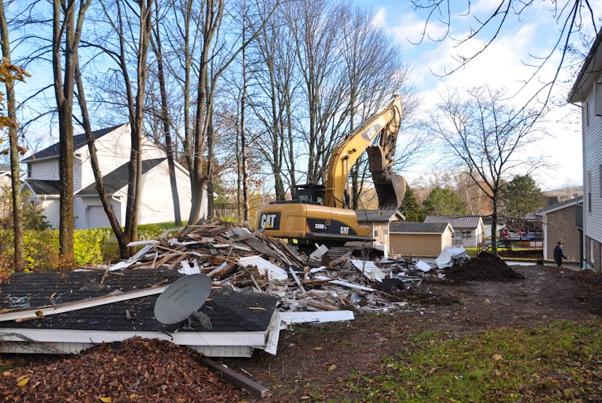 An excavator made short work of the property at the corner of Cameron Ave. and Abecrombie Rd.