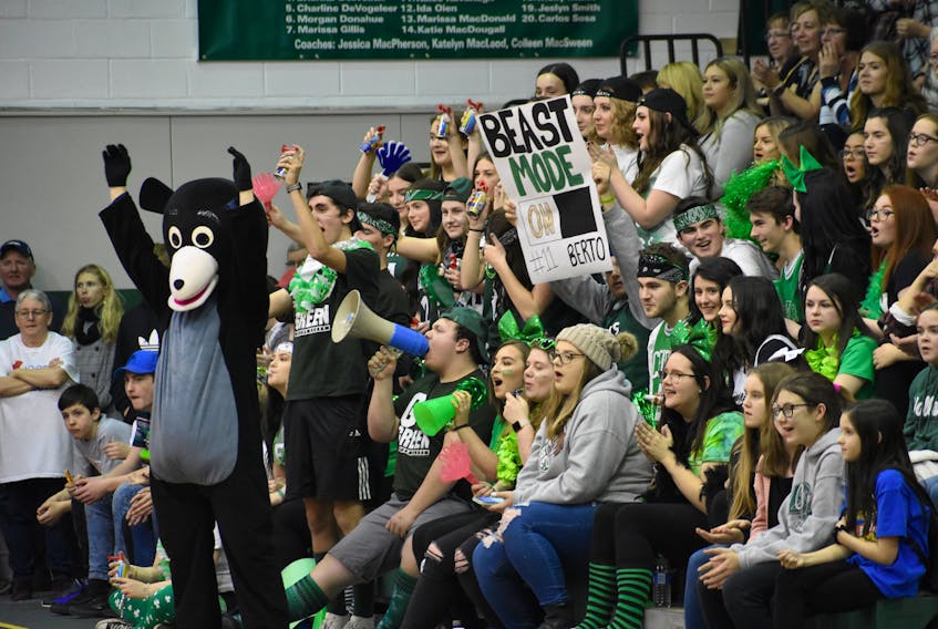 Breton Education Centre Bears supports are shown cheering the team on during the New Waterford Coal Bowl Classic earlier this week at the BEC gym in New Waterford. The Bears will play the Riverview Royals in the semifinals Friday at 7 p.m. in New Waterford.