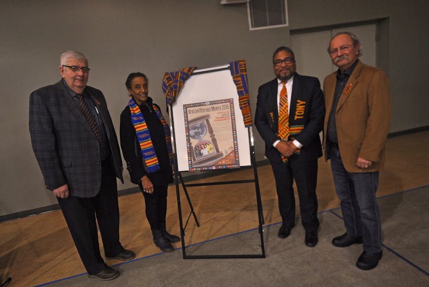 This year’s African Heritage Month theme ‘Educate, Unite, Celebrate Community’ was unveiled Feb. 1 in Springhill by [from left] Allison Gillis, Theresa Halfkenny, the Honourable Tony Ince and David Kogon.