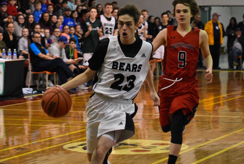 Jason Murphy of the Breton Education Centre Bears, left, drives to the basket as Brayden MacDonald of the Northumberland Nighthawks follows during New Waterford Coal Bowl Classic action at BEC gym on Wednesday. The Bears won the game 79-65, securing their spot in the semifinals on Friday.