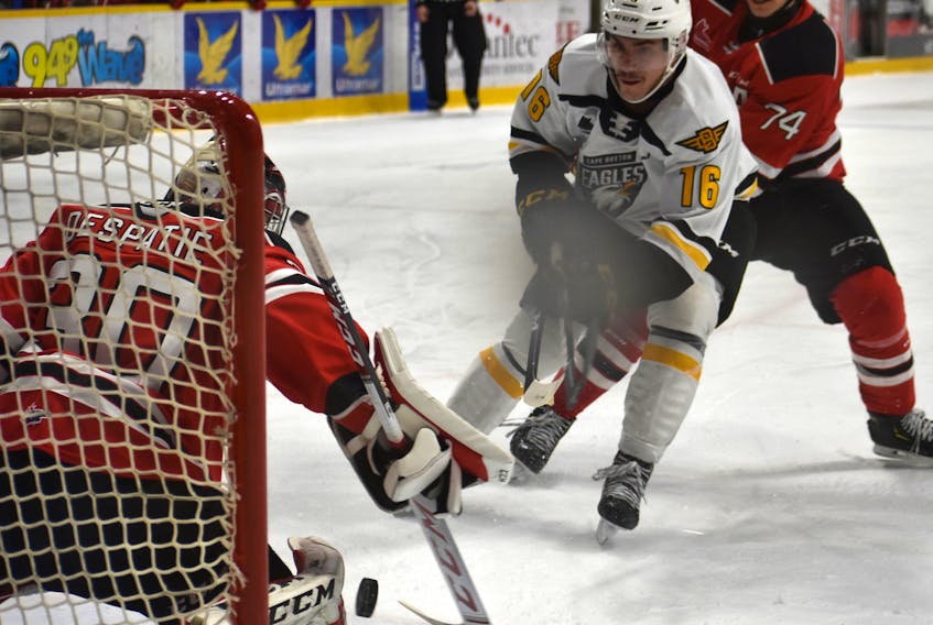 Shawn Element of the Cape Breton Eagles, right, takes a shot on Emerik Despatie of the Quebec Remparts during Quebec Major Junior Hockey League action at Centre 200 on Wednesday. Despatie would make the save on the play. Cape Breton won the game 6-1.