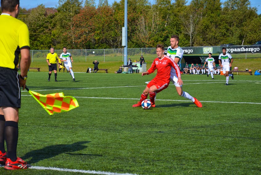 Tyler Kirby, 10, of the Memorial Sea-Hawks protects the ball from the UPEI Panthers’ Lucas Ross during Atlantic University Sport men’s soccer play in Charlottetown on Saturday afternoon. Memorial won the game 3-0.