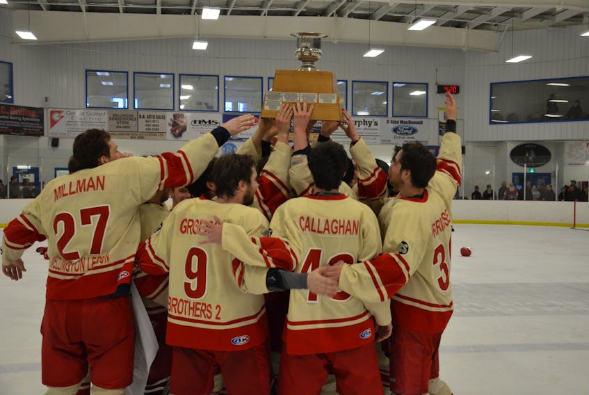 The Western Red Wings celebrate after being presented with the Island Junior Hockey League championship trophy. The Red Wings defeated the Vipers 8-4 in Abram-Village on Sunday afternoon to win the best-of-seven final series 4-1.