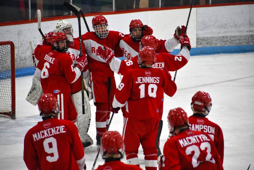 The Riverview Redmen celebrate after winning the Cape Breton High School Hockey League Highland region championship title on Thursday. The Redmen defeated the Glace Bay Panthers 6-1, sweeping the best-of-three series 2-0 at the Canada Games Complex.