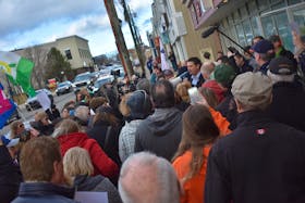 A crowd wanting to stage a healthcare sit-in at the office of Glace Bay MLA and provincial Liberal cabinet minister Geoff MacLellan this morning eventually gathered around him as he and Sydney-Whitney Pier MLA and cabinet colleague Derek Mombourquette came outside to speak with them.
