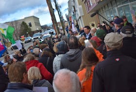 A crowd wanting to stage a healthcare sit-in at the office of Glace Bay MLA and provincial Liberal cabinet minister Geoff MacLellan this morning eventually gathered around him as he and Sydney-Whitney Pier MLA and cabinet colleague Derek Mombourquette came outside to speak with them.