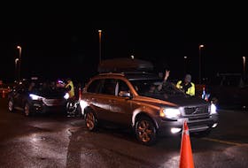 The first few vehicles pass through the P.E.I. checkpoint at the Confederation Bridge just before 12:01 a.m. Friday, July 3.