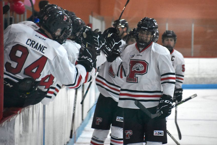 Logan Snow of the Glace Bay Panthers, right, celebrates a goal with his fellow teammates during a game against the CEC Cougars during the Panther Classic high school hockey tournament at the Canada Games Complex in Sydney. Glace Bay won the game 7-6 in a shootout.