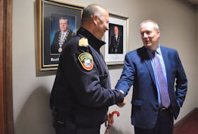 Fire Chief Ron Enman congratulates Ron Philpott, incoming CAO for the City of Summerside announced on Dec. 16.