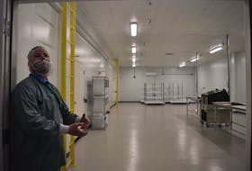 Curt Gunn showing off the trimming room. This is where separation of the cannabis flowers and leaves takes place.