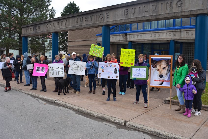 Protesters outside Pictou Provincial Court demanding harsher penalties for animal abusers.