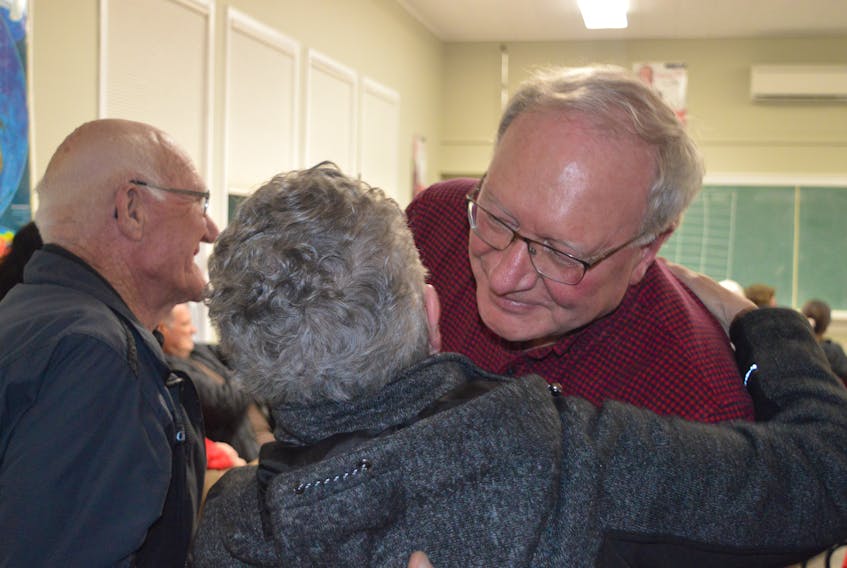 Liberal Leader Wade MacLauchlan consoles a supporter after he lost his District 8 Stanhope-Marshfield seat Tuesday night.