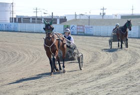 Mary Hawkins, left, had Rich By State out for a jog Saturday, March 21, at Red Shores at the Charlottetown Driving Park while Nicholas Oakes was at the reins for Legendary Ron.
