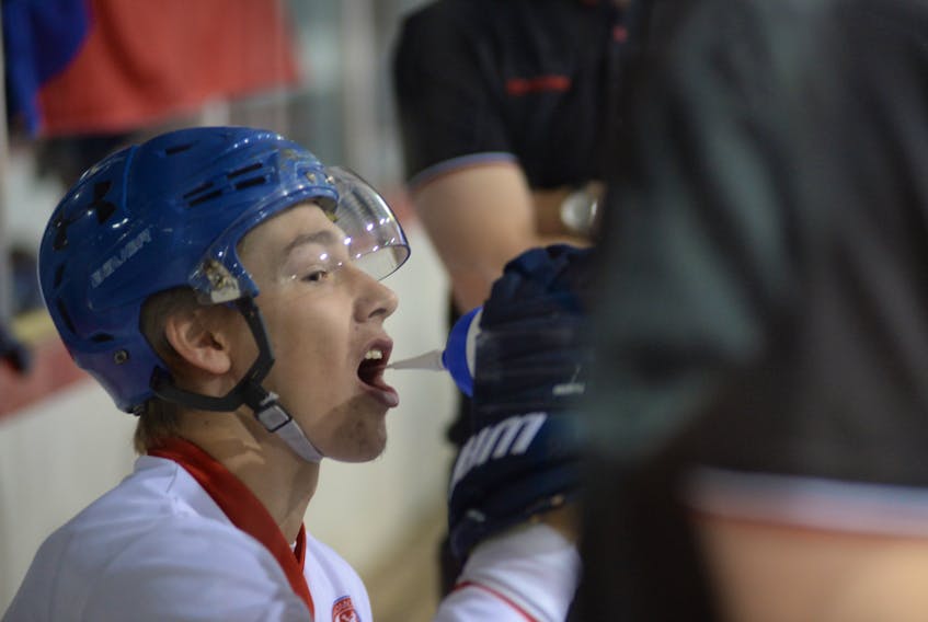 The Czech Republic's Adam Kubik gets a swig of hydration on the bench during a game against Slovakia Friday morning. Kubik been one of the top players for the Czech Republic’s under-20 team at the world junior ball hockey championships, being played at the Glacier in Mount Pearl this week.
