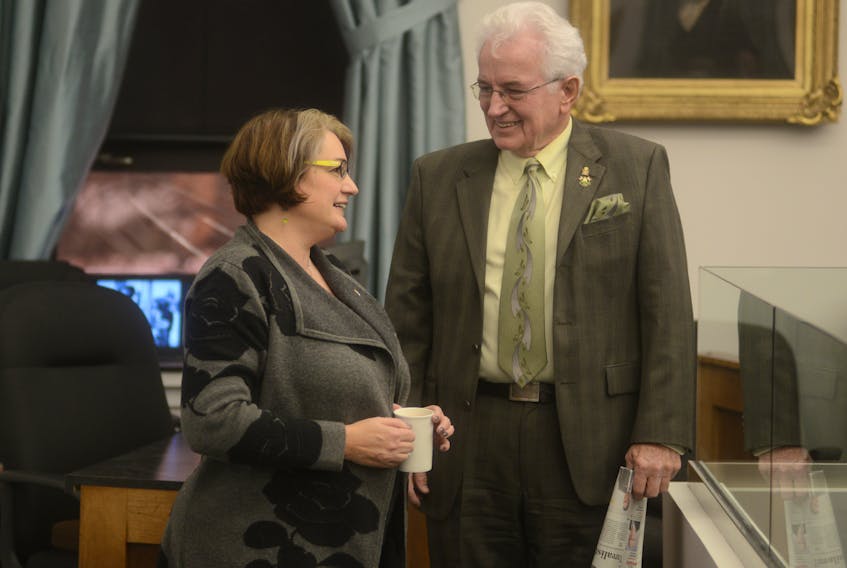 Charlottetown-Parkdale MLA Hannah Bell chats with West Royalty-Springvale MLA Bush Dumville before Wednesday’s question period in the P.E.I. legislature. Bell described the timing of last week’s announcement for a new UPEI residence as “curious” and suggested it was connected to the province hosting the 2023 Canada Winter Games.