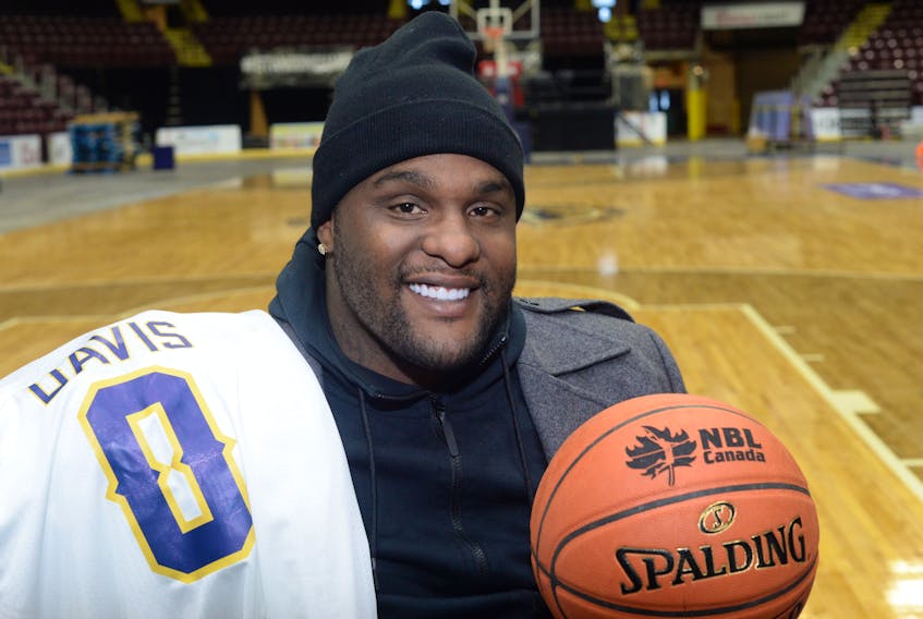 Foprmer NBA star Glen Davis poses on the court at Mile One Centre after officially signing with the St. John's Edge Wednesday afternoon. Davis, who won an NBA championship with the Boston Celtics, will be in the Edge lineup Friday night at Mile One for a game against the Island Storm.