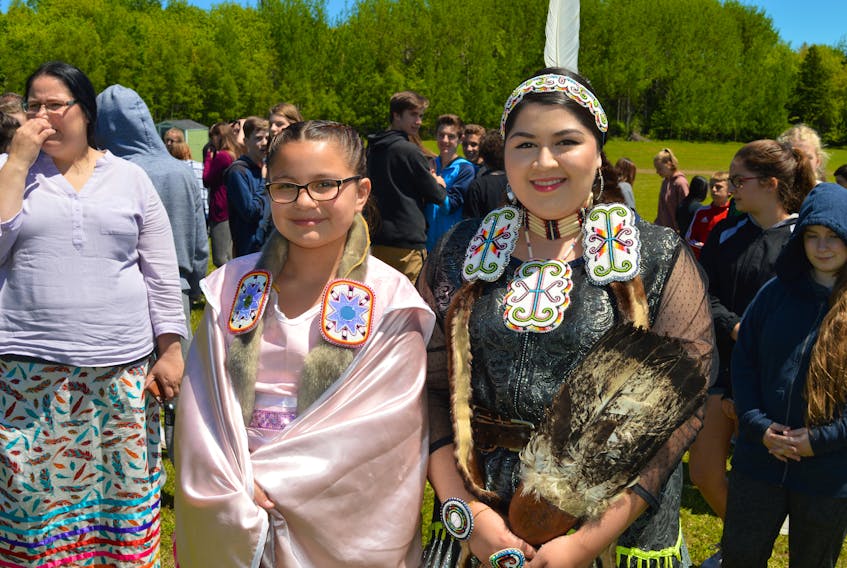 Carmen Jadis, left, and Misiksk Jadis were dressed in traditional Mi’kmaq attire during Mawi’omi Day on Thursday at the Abegweit First Nation in Scotchfort. They led students from three Island schools in the dancing and drumming circle as part of the activities at the reserve.