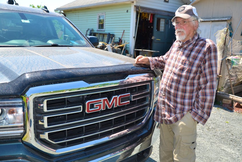 Dennis Smith of Dartmouth says the dust that settles in his yard and on his truck makes it impossible to hang out clothes or to enjoy a barbecue.