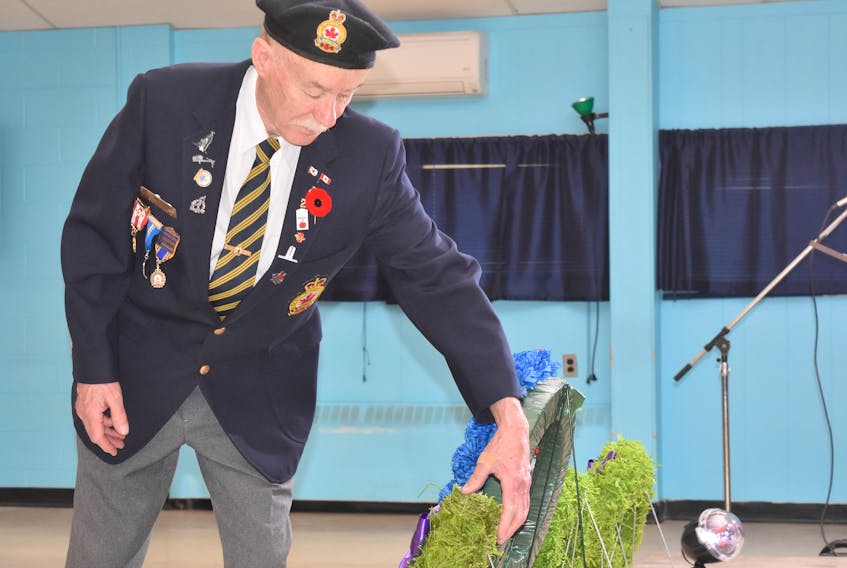 Jack Chaisson, president of the Stellarton legion places a wreath during a ceremony to commemorate the 75th anniversary of D-Day which was held at the Stellarton Legion on Thursday.