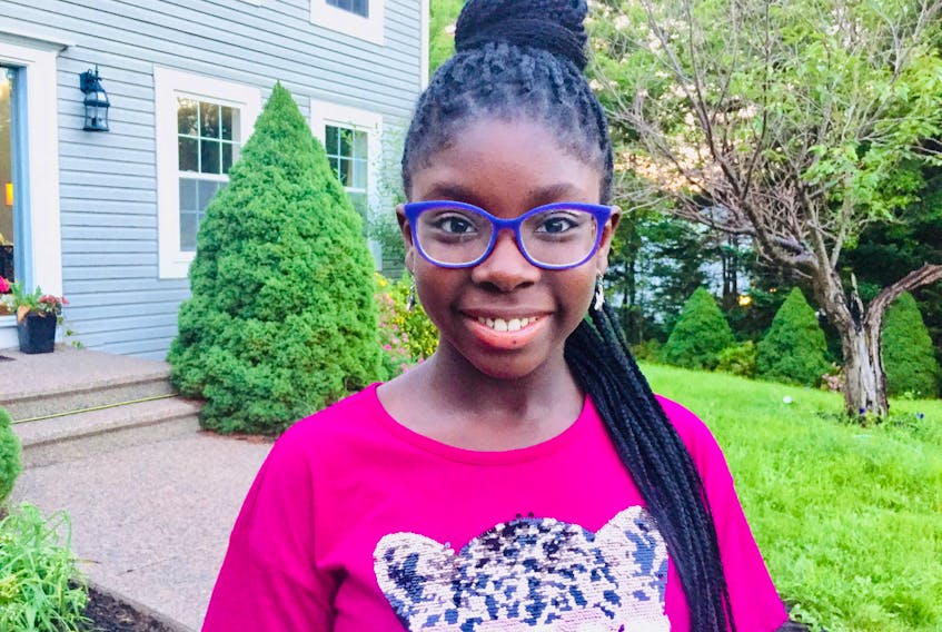 Wellness Within has announced 13-year-old Damini Awoyiga as its first-ever junior artist in residence. She is pictured outside her home in the Hammonds Plains area in July 2020.