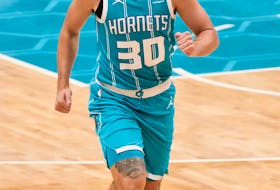 Charlotte Hornets guard Nate Darling runs up court against the Toronto Raptors during the second half of an NBA game Saturday night at Spectrum Center in Charlotte, N.C. - Jim Dedmon / USA Today Sports
