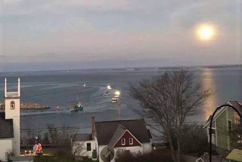Monday was dumping day off Nova Scotia's south shore. Nancy Myatt captured this poignant scene as the boats headed out in Area 33. A beam of light from the full Beaver Moon guided the boats out to sea. Prayers that the light will keep them safe through the lobster fishing season.