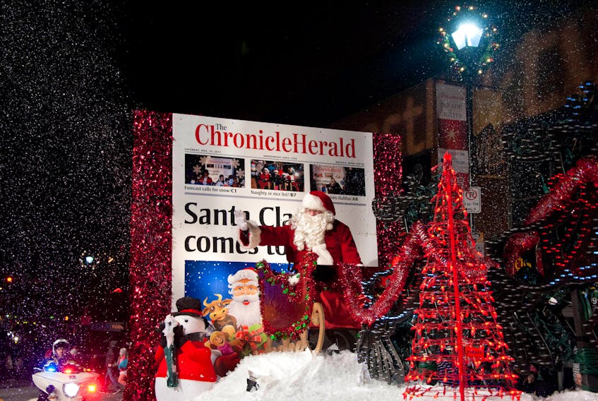 Santa waves to the crowd during the Chronicle Herald Holiday Parade of Light in Halifax, November 16th, 2013.