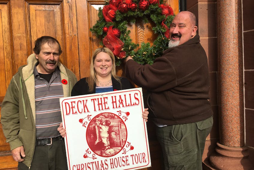 (From left) Jim Murphy, Angela Marks and Rev. Don Miller prepare for the Deck the Halls Christmas House Tour that’s taking place on Saturday, Dec. 7 from 2 to 7 p.m.