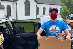 On behalf of The Public Good Society of Dartmouth, Rev. Kevin Little — pictured here on July 1, 2020, near the Christ Church food bank in Dartmouth — delivers 25 boxes of food to people who cannot access local food banks. - Don Clarke.