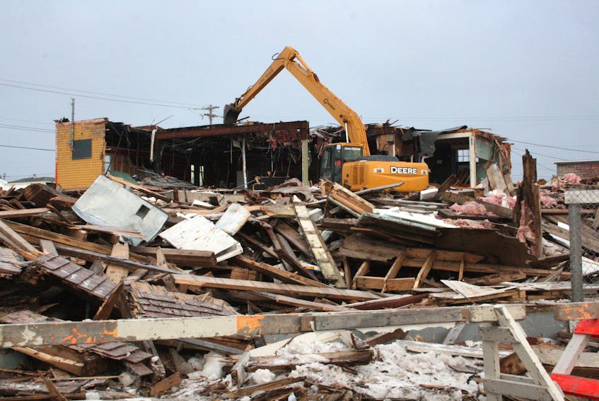 Bennett’s Construction was awarded a contract to tear down and clean up the partially-standing Samuel J. Harris Building on Grand Bank’s waterfront. A backhoe was busy at work on Wednesday, Jan. 15. PAUL HERRIDGE/THE SOUTHERN GAZETTE