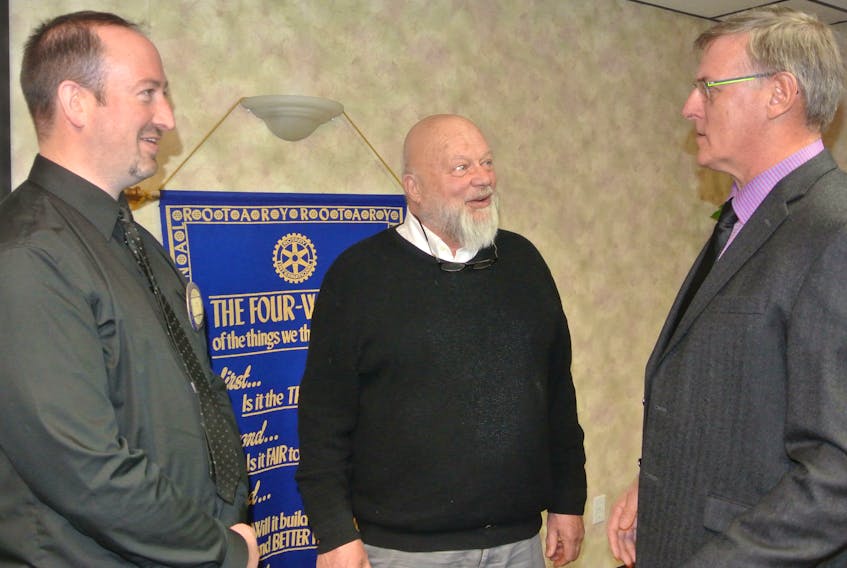 Cumberland County Deputy Warden Joe van Vulpen (right) speaks to former county warden Keith Hunter (center) and Amherst Rotary Club president David McNairn following a Rotary meeting on Monday.