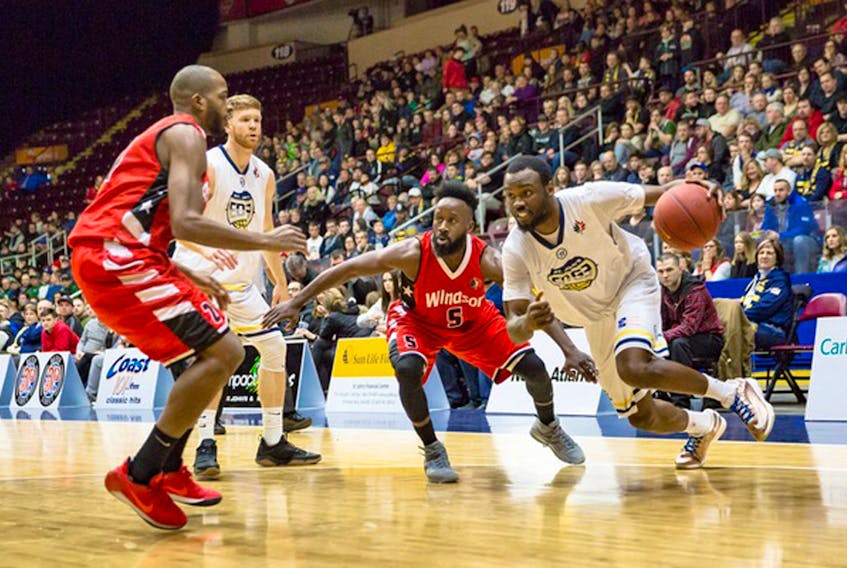 Desmond Lee (right) and the St. John's Edge couldn't find a way past Omar Strong (5) and the Windsor Express Tuesday night at Mile One Centre. — St. John's Edge photo/Jeff Parsons