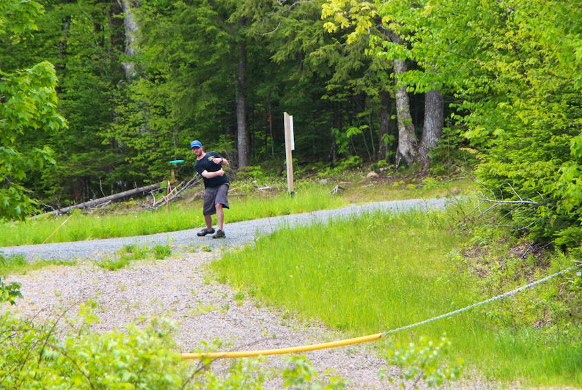 James Broesch lets his disc fly during June 16 play at the Keppoch Mountain course.