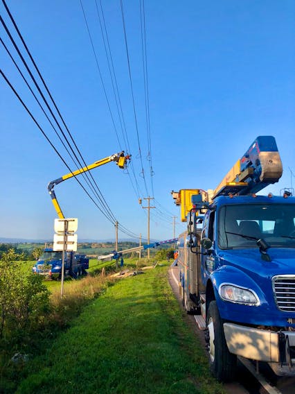 Maritime Electric crews work to restore power in the New Glasgow area Wednesday morning. - Maritime Electric Twitter photo