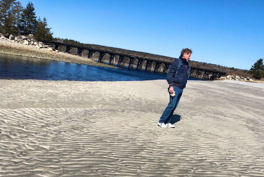 Don Jones stands on Summerville Beach on the South Shore, near where he's staying, before the province ordered beaches closed to the public. - Contributed