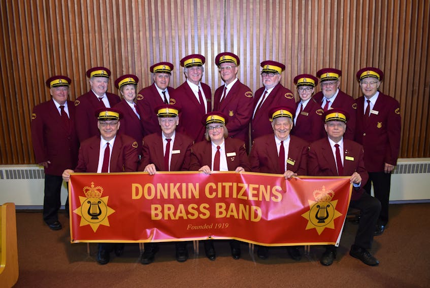 The Donkin Citizens Brass Band is celebrating their 100th anniversary on July 19 and doing free celebratory concerts on July 12 (at the Donkin Legion) and July 14 (at St. Luke’s United Church). Pictured here are the current members of the band who perform at Remembrance Day services, nursing homes and other community events.  Pictured here are: (front from left) Kevin MacLean, Mike Butler, Charlene Reid, Ernie Snow, Ken Reid, (back from left) Matt Hurley, Art Borden, Jane MacGregor, Roy Anderson, Frank MacKenzie, Chris Jewett, Pat Reid, Mary Sharpe, Bernie VanDonic, Fred Courtney.