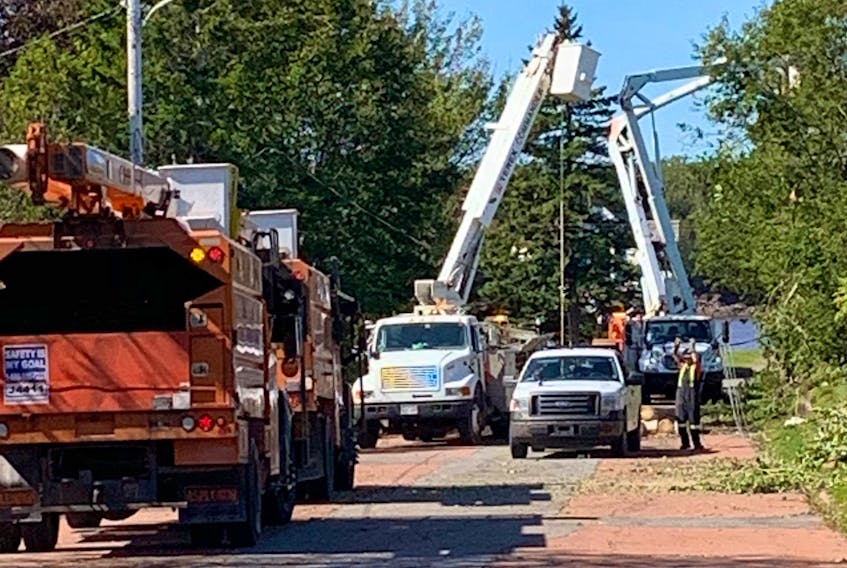 Crews from Nova Scotia Power work to reconnect power on King Street in Pugwash on Tuesday morning. Ian Murray photo