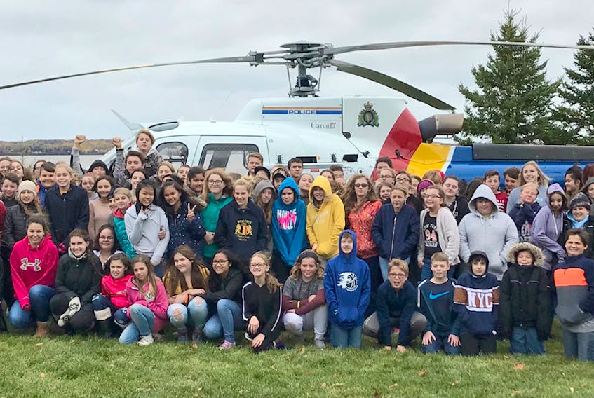 Students from the area recently took part in the Cops N Kids Leadership camp in Tatamagouche, N.S. Above, local youth were among the large group of Tantramar and Cumberland students who had the opportunity to find out more about RCMP air services at the camp from Oct. 24-28.