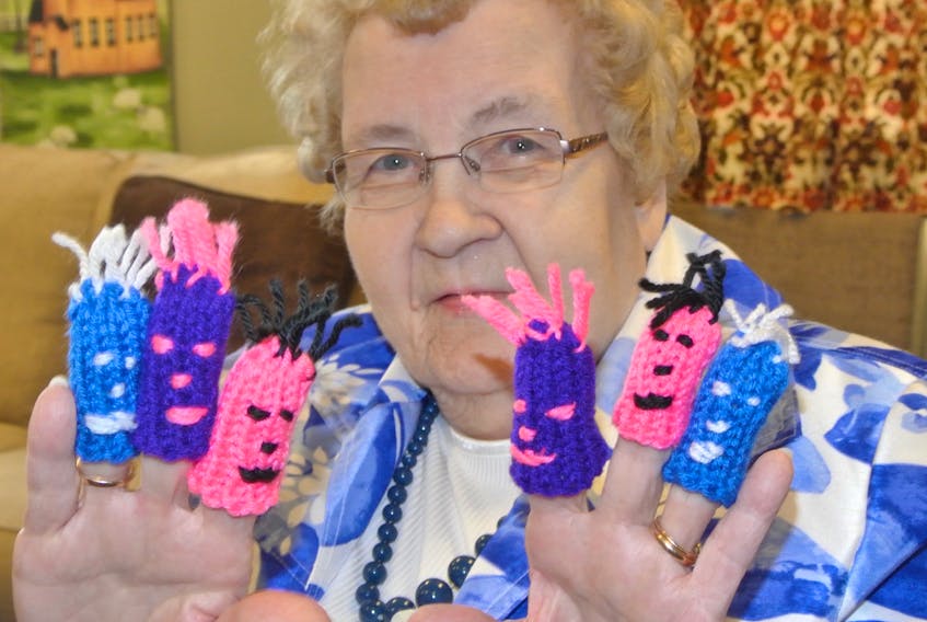 Helen Smith of Amherst holds up some of the finger puppets she has made for children at the Cumberland Regional Health Care Centre. The 50-year member of the Trinity-St. Stephen’s UCW has made thousands of the puppets over 32 years, but has had to stop because of arthritis.